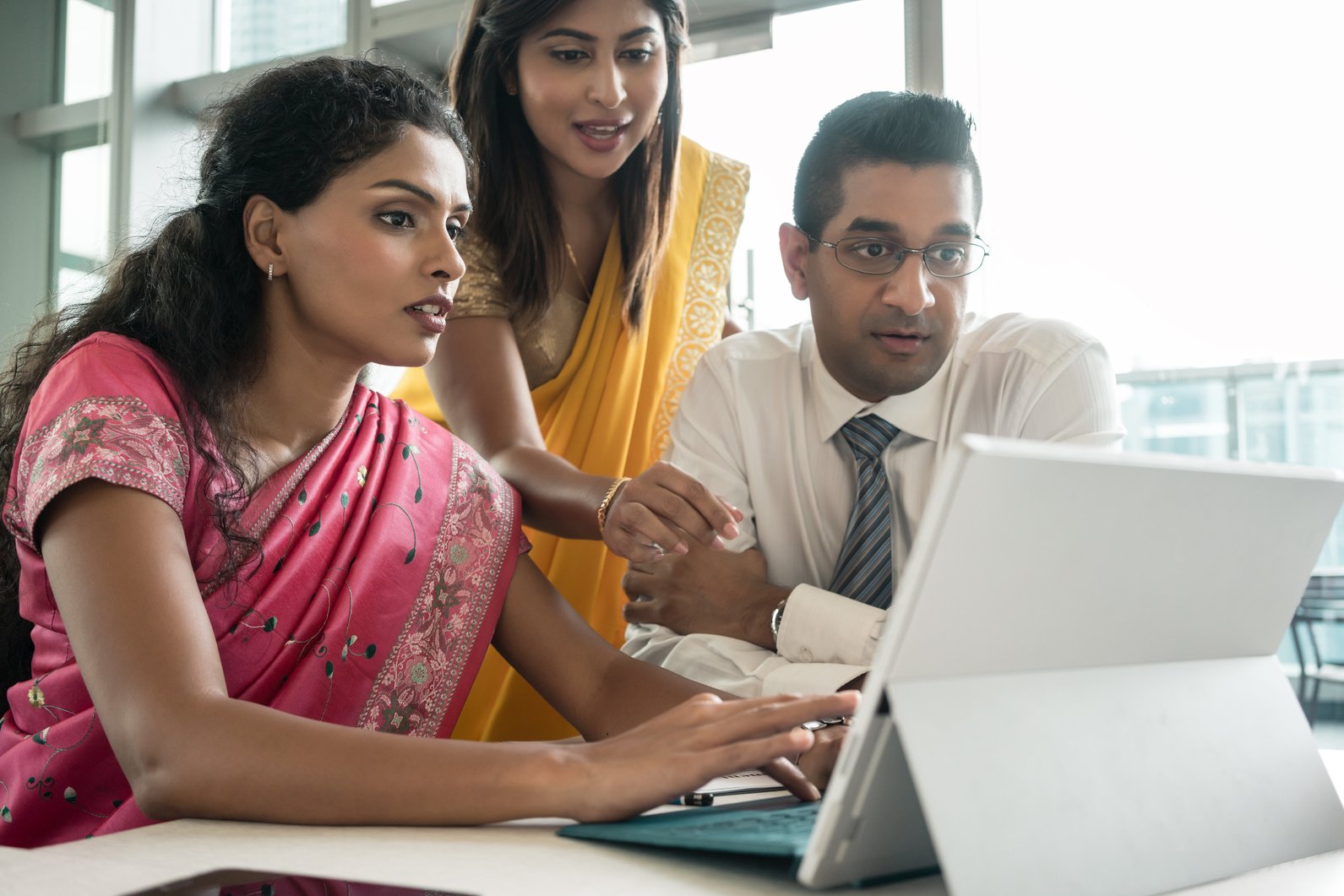 Three Indian Employees Working Together 