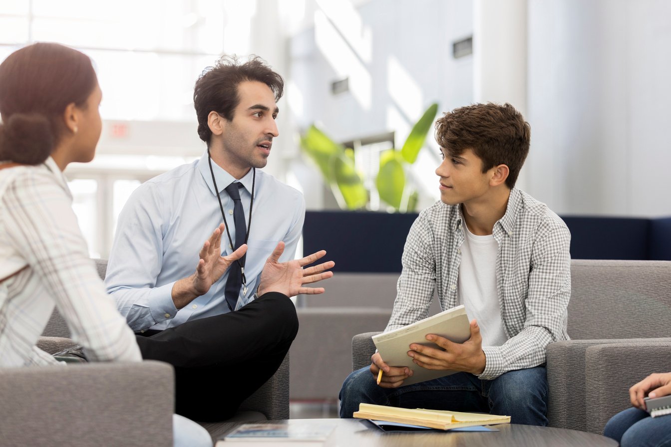 School principal meets with a group of students